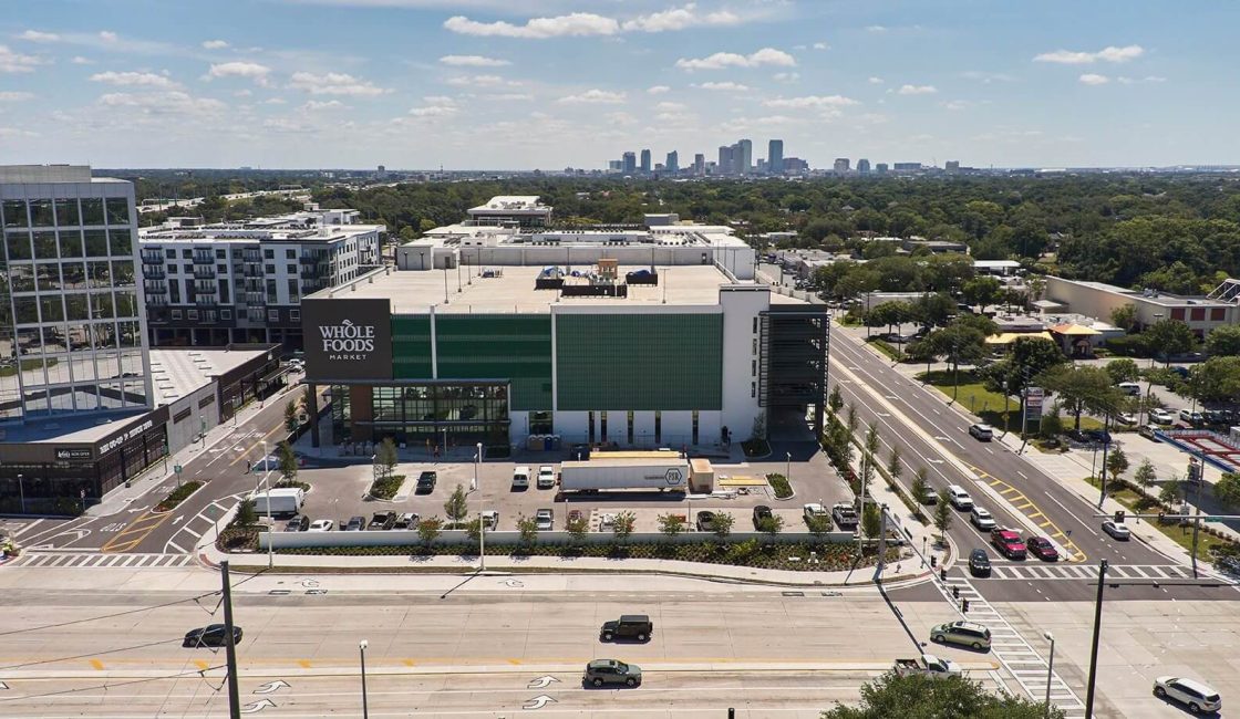 A large building with lots of windows on the side.