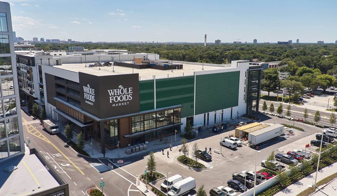 A large building with lots of parking spaces.