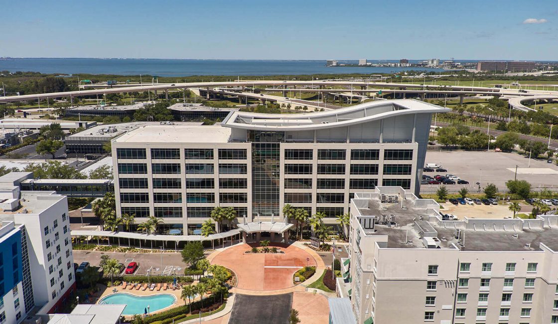 A large building with a pool in the middle of it