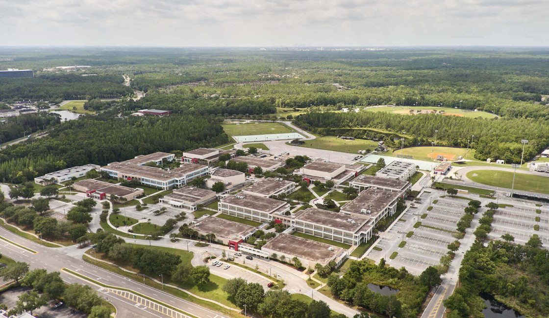An aerial view of a large campus with buildings.