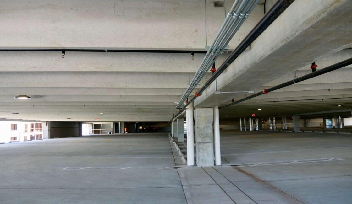 A large empty parking garage with no one in it.
