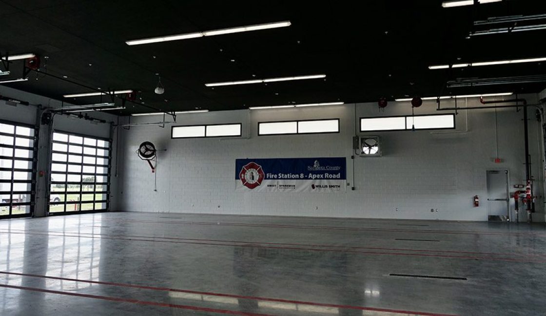 A large room with a sign on the wall.