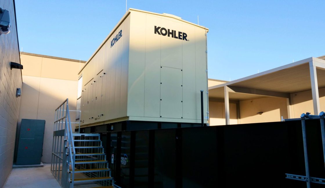 A large white building with the word kohler on it.